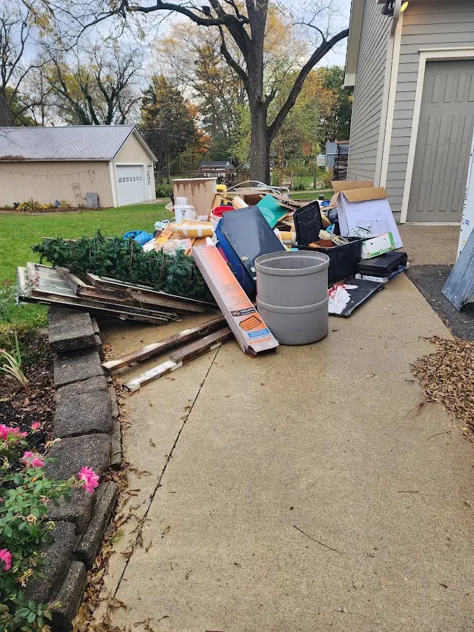 Dumpster being loaded with debris for 10 Yard Dumpster Rental in Mountain View